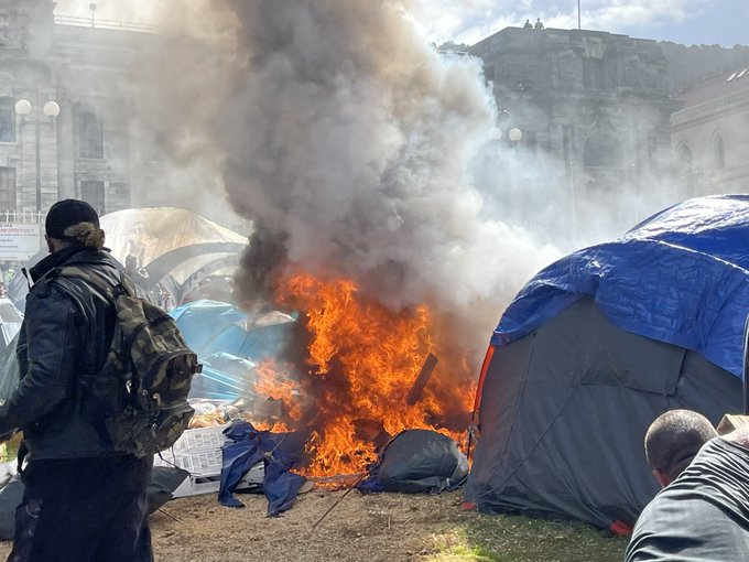 A fire amid the tents on Parliament grounds
