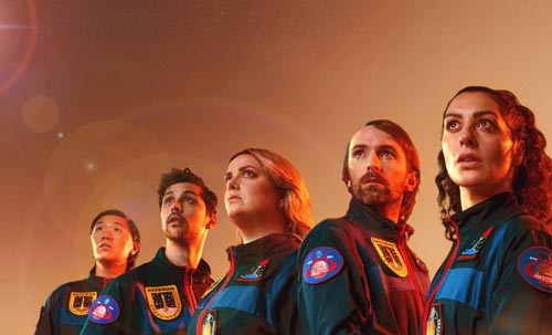 Three men and two women dressed in space suits look beyond with anxious expressions on their faces Photo credit: Destination Mars