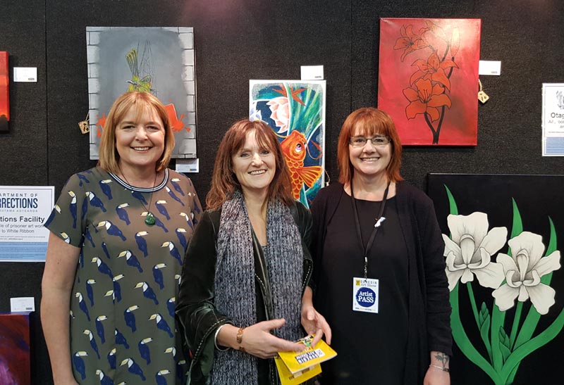 Sherie Lucke with Deputy Prison Director, Lyndal Miles and Interventions Co-ordinator, Sacha Bignell at the Dunedin Art Show