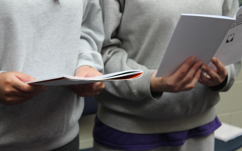 Prisoners read their work to visitors