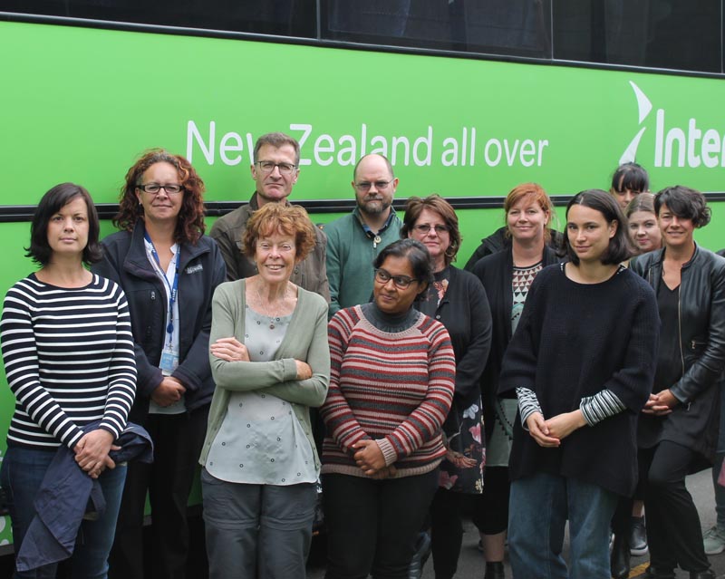 A busload of visitors outside the prison