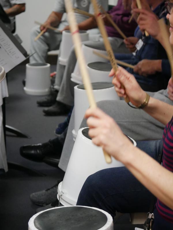 Drumming in a Christchurch Symphony Orchestra workshop with men in the Navigate Unit of Christchurch Men's Prison 