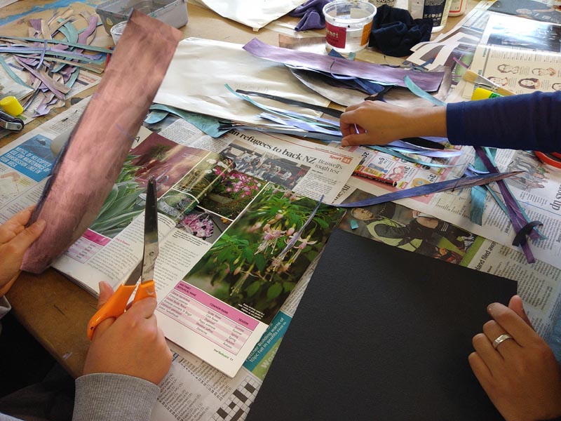 Art therapy student Negin Dastgheib assists an artist during a Tuesday workshop