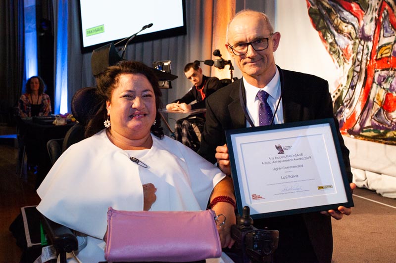 Lusi, with award sponsor Kieran O'Sullivan, receiving her Highly Commended certificate at Te Putanga Toi Arts Access Awards 2019