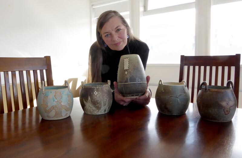 Hedy Ankers with her five award trophies