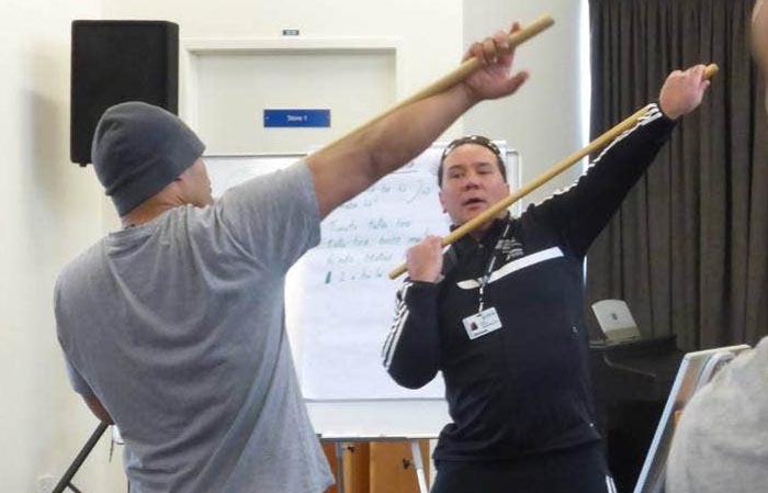 Rue-Jade Morgan teaching mo rakau to participants in his Te Hōkai Manea Tīpuna programme