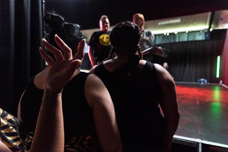 The image on the cover of the literature review is of Home Ground artists rehearsing for the Arohata Women's Prison concert 2020 Photo: Fraser Crichton