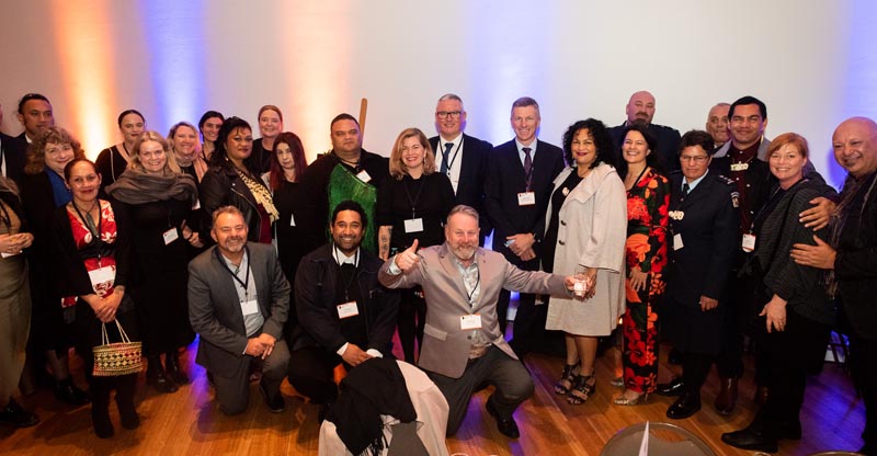 a group photo of Corrections staff and Arts in Corrections members with Hon Kelvin Davis