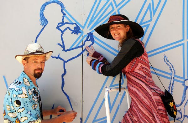 Struan Ashby and Erica Duthie working on a tape art project