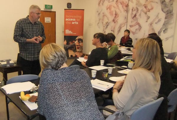 Michael Crowley leads a creative writing workshop for writers and Corrections staff