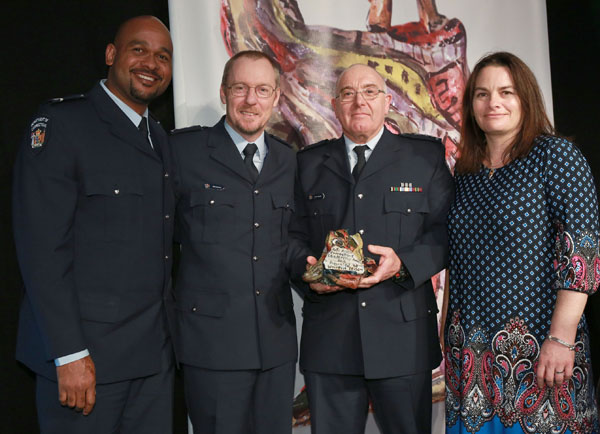 Chief Custodial Officer Neil Beales presenting Waikeria Prison with the Arts Access Corrections Leadership Award 2015 From left: Anwar Saady (Corrections Officer), Neil Beales, Kevin Smith (Prison Director), Catherine King (acting Principal Psychologist, Special Treatment Unit)