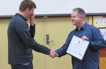Michael Krammer receives his certificate from Richard Benge