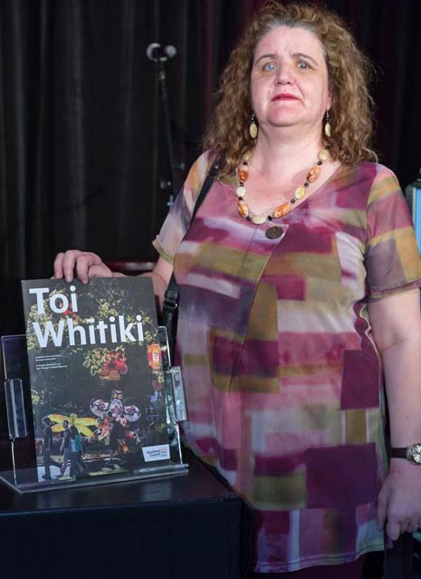 Martine Abel with a copy of Toi Whitiki