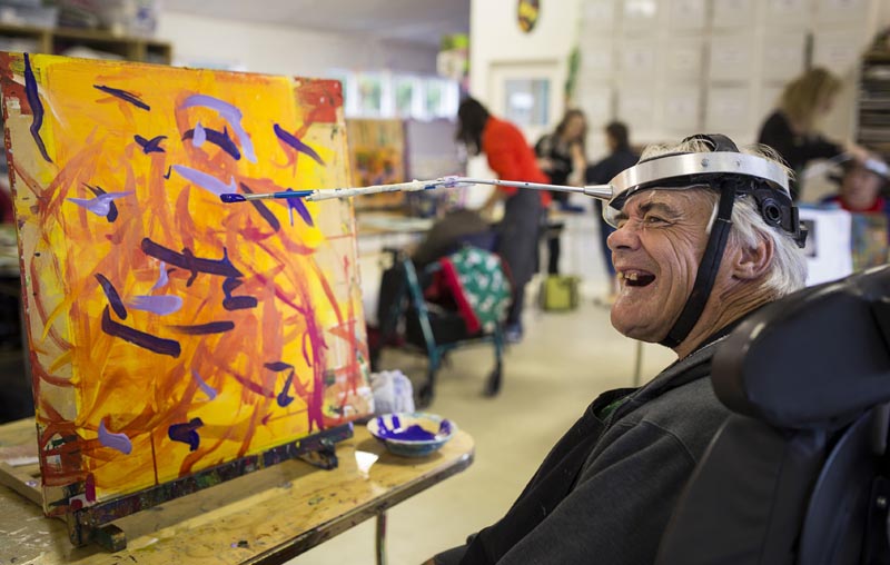 John Penman works on a painting at Māpura Studios, Auckland