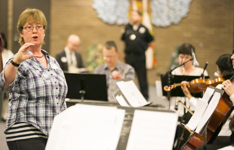 Sarah Lee, conductor, with musicians