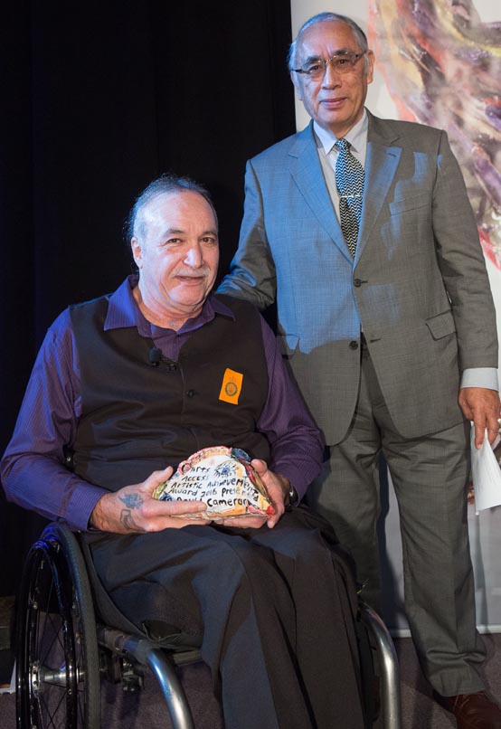 David Cameron, presented the Arts Access Artistic Achievement Award 2016 by senior Maori artist Darcy Nicholas