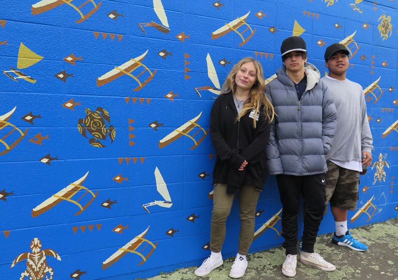 Maddy Marshall, Jonah Davis and Blaine Bethan-Taape are proud of the mural they helped paint
