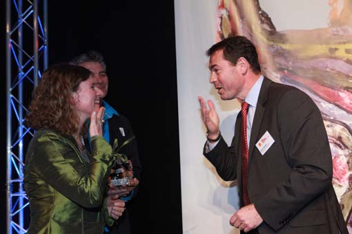 Olivier Lacoua presents the Arts Access CQ Hotels Wellington Community Partnership Award 2013 to one of the recipients, Rachel Coppage