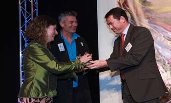 Rachel Coppage, Giant Leap Fonudation, and Erwin van Asbeck, Toi Ora, receive the Big 'A' CQ Hotels Wellington Community Partnership Award 2013 from Olivier Lacoua, General Manager, CQ Hotels Wellington