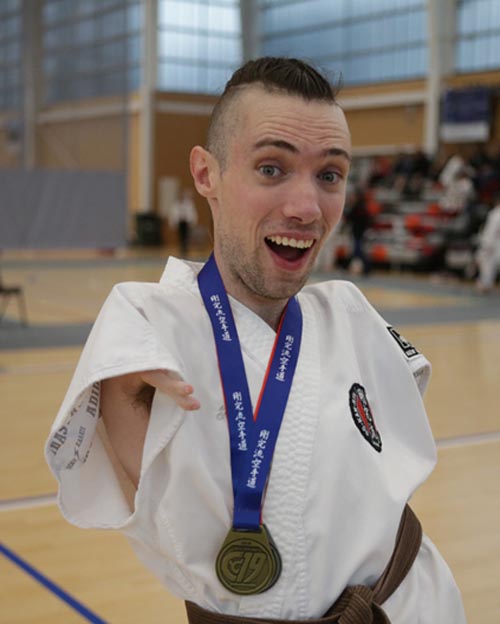 Jase Smithyman with one of his karate medals