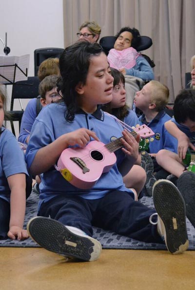 A child from Mahinawa Specialist School enjoy the relaxed concert at Pataka Art + Museum Photo: Hannah Beattie Photography courtesy of Chamber Music New Zealand