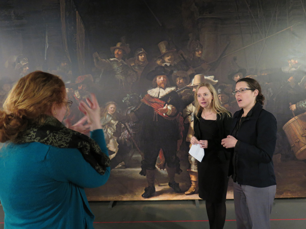 Teresa Cooper learns about Rembrandt's paintings from Dr Erin Griffey, with assitance from sign interpreter Bridgette Strid, before becoming a Deaf tour guide for the Rembrandt exhibition at the NZ Academy of Fine Arts