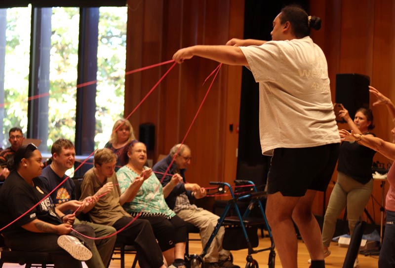 A Jolt dancer using ribbons and engaging with audiences during a performance rehearsal Photo: Christchurch Symphony Orchestra