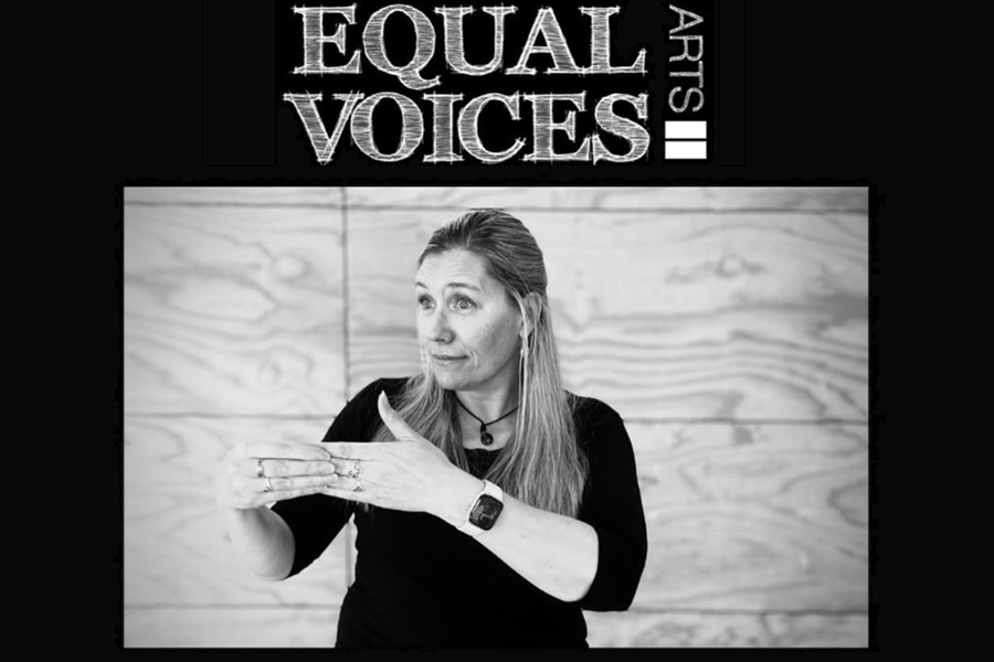 Rachel Turner, Company Manager of Equal Voices Arts, signs at an event using NZSL.