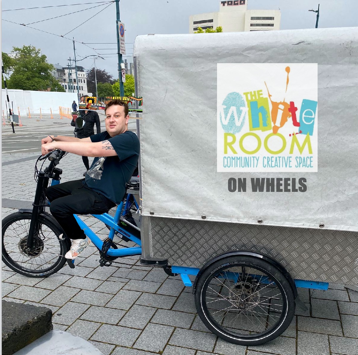 White Room artist Isaac Tait with the electric cargo bike