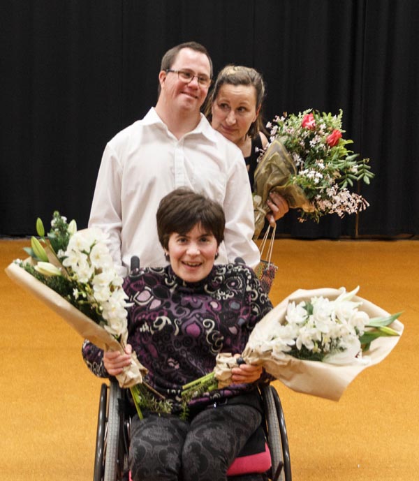 WIDance members Kezia Bennett and David Ledingham, and tutor Sumara Fraser, with some of the flower bouquets that were handed out