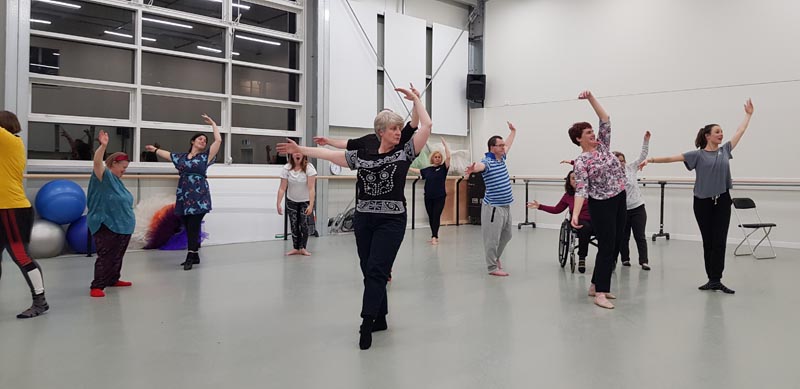 WIDance members learning some steps with members of the Royal New Zealand Ballet